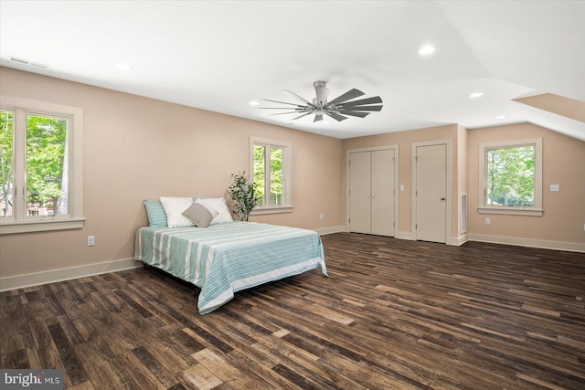 bedroom with dark wood-type flooring, ceiling fan, and lofted ceiling