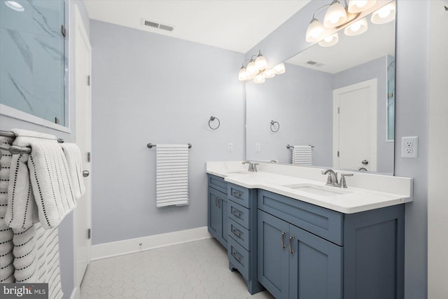 bathroom featuring double vanity and tile flooring