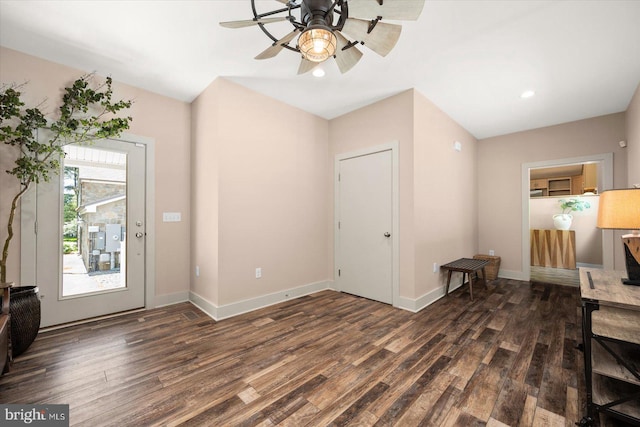 foyer with ceiling fan and dark wood-type flooring