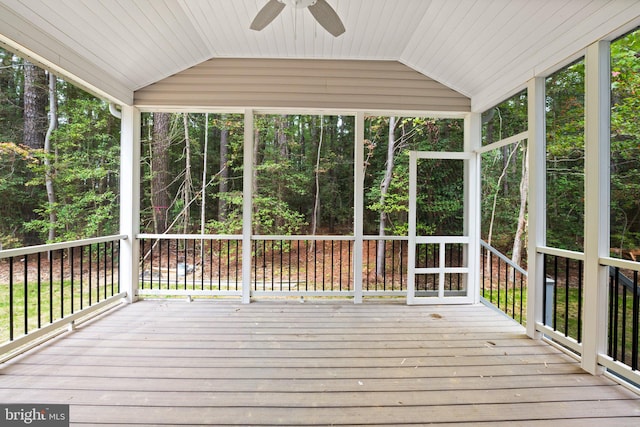 unfurnished sunroom featuring ceiling fan and vaulted ceiling