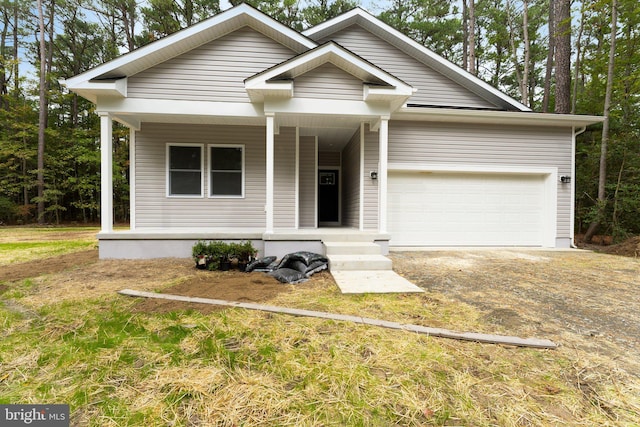 view of front of house with a porch and a garage