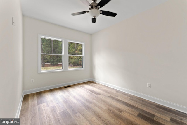 unfurnished room with ceiling fan and light hardwood / wood-style floors