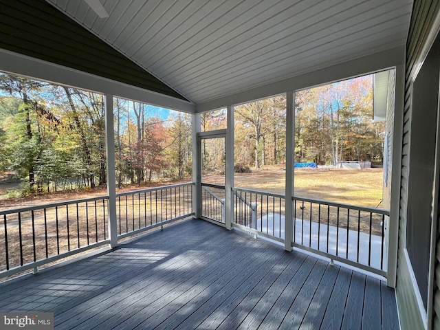 unfurnished sunroom with wooden ceiling and lofted ceiling