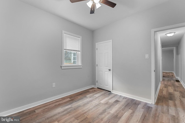 unfurnished room featuring light wood-type flooring and ceiling fan