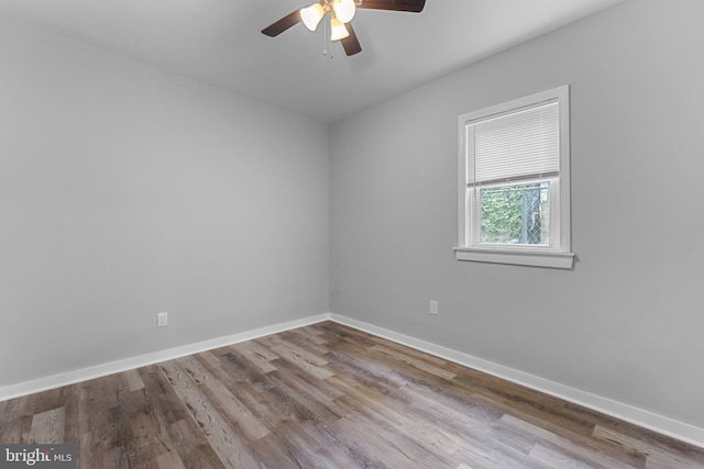 empty room with ceiling fan and light wood-type flooring