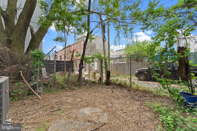 view of yard featuring central air condition unit