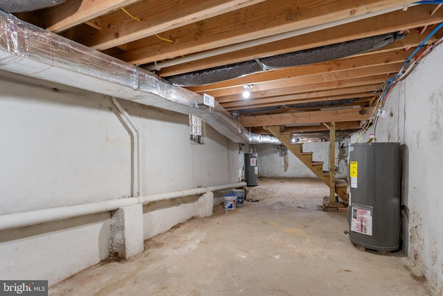 basement featuring water heater and gas water heater