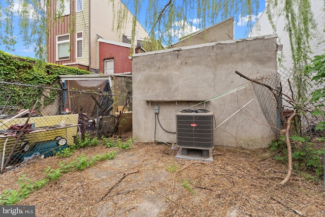 view of side of home with central air condition unit