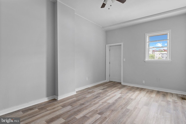 unfurnished room featuring ceiling fan and light hardwood / wood-style floors