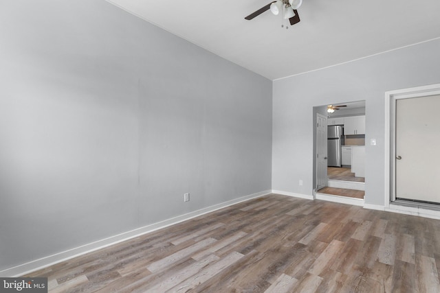 unfurnished living room with ceiling fan and light hardwood / wood-style flooring