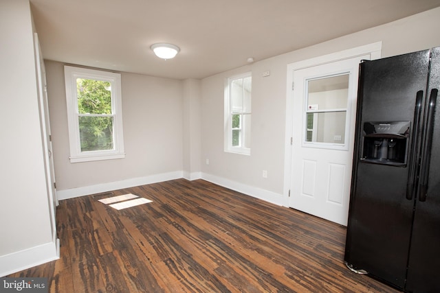 empty room featuring dark wood-type flooring