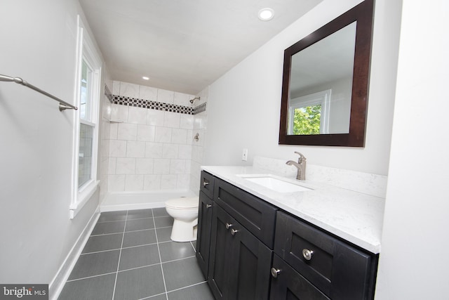 bathroom with vanity, tile floors, and toilet