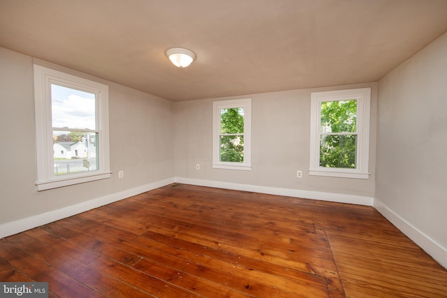 spare room featuring hardwood / wood-style floors