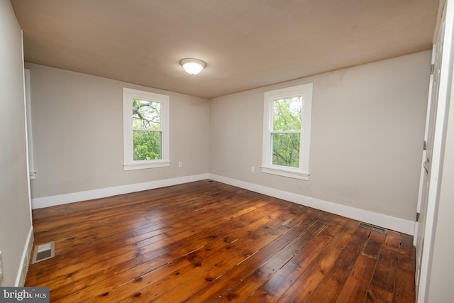 unfurnished room with hardwood / wood-style floors