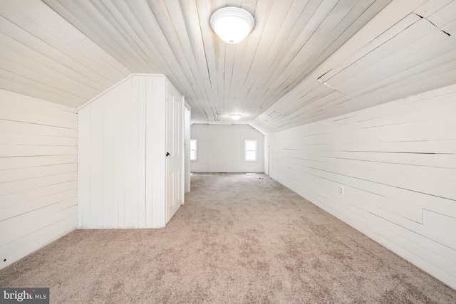 bonus room featuring carpet floors and lofted ceiling