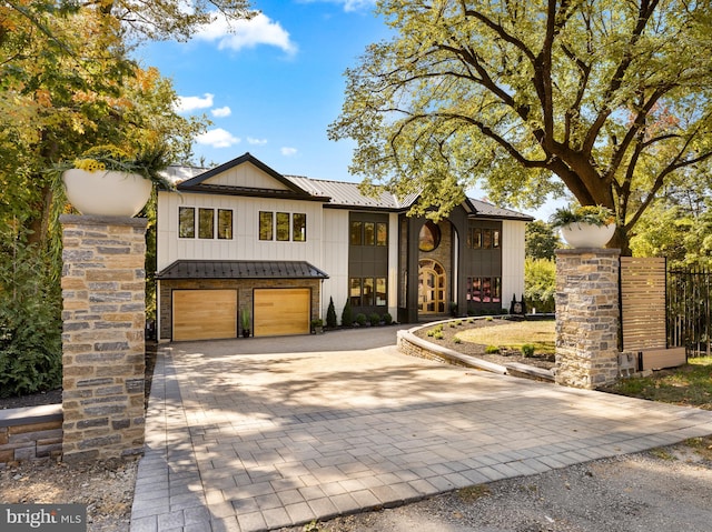 view of front of property featuring a garage