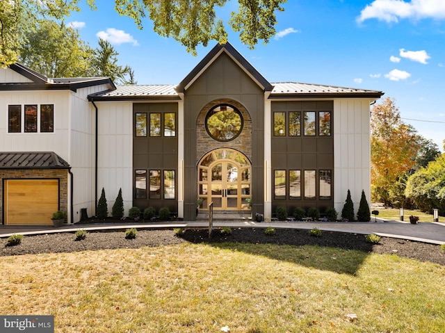 view of front of property featuring a front lawn and french doors