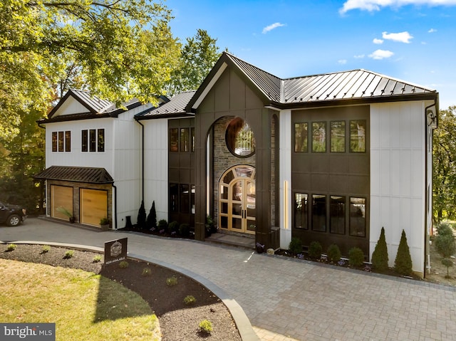 modern farmhouse style home with a garage