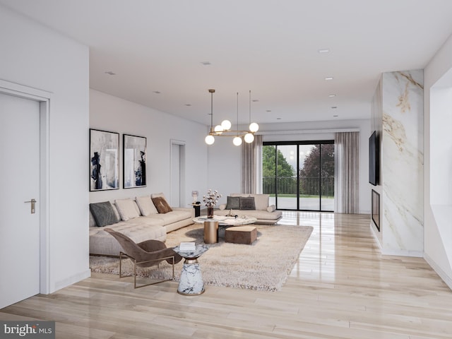 living room featuring light hardwood / wood-style floors and an inviting chandelier