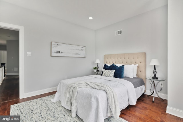 bedroom with dark wood-type flooring