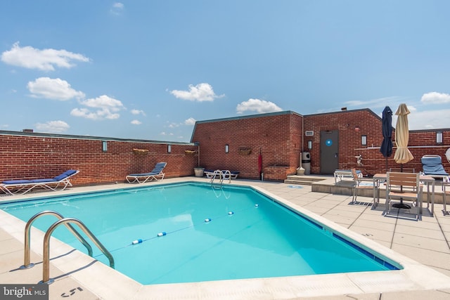 view of swimming pool featuring a patio area and a fenced in pool