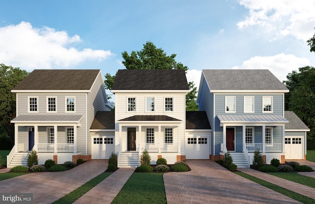 colonial inspired home with an outdoor structure and a garage