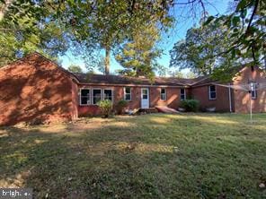 ranch-style home with a front yard