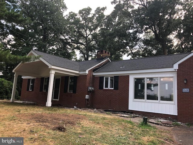 exterior space featuring a front yard and covered porch