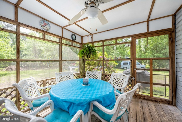 sunroom / solarium featuring ceiling fan