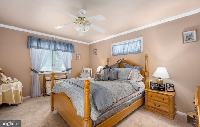 carpeted bedroom with ceiling fan and ornamental molding