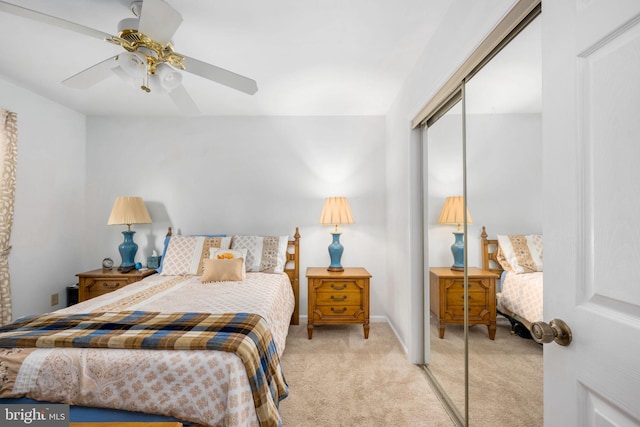 bedroom featuring a closet, ceiling fan, and light colored carpet