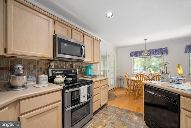 kitchen featuring appliances with stainless steel finishes, ornamental molding, light brown cabinets, decorative light fixtures, and dark hardwood / wood-style floors