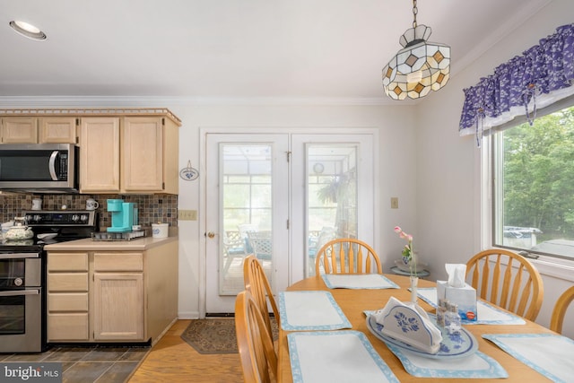 dining room with dark hardwood / wood-style flooring and crown molding