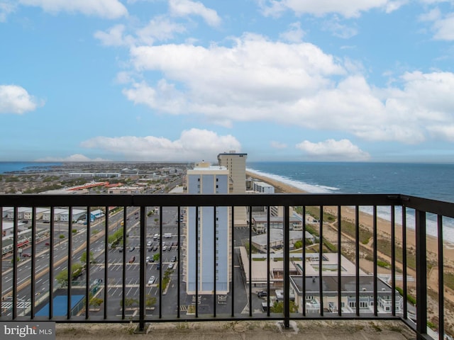 balcony with a view of the beach and a water view