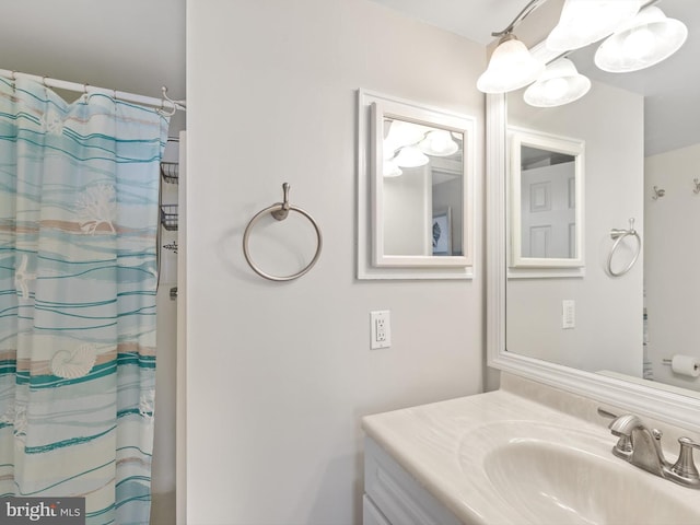 bathroom featuring vanity and a shower with curtain