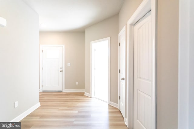 corridor featuring light hardwood / wood-style floors