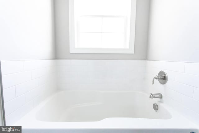 bathroom featuring a tub