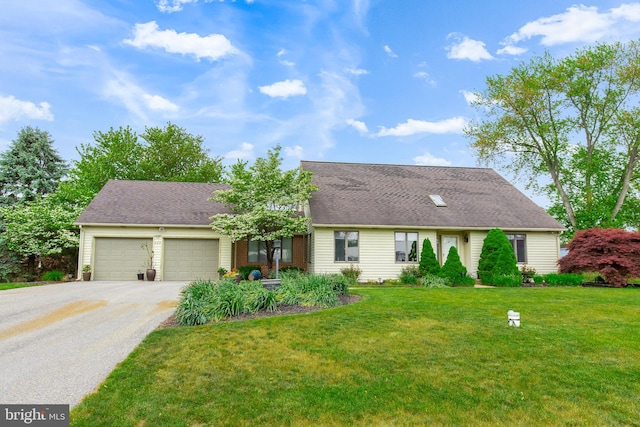 409 Hilltop Rd, Strasburg, PA 17579 - view of front facade featuring a garage and a front lawn