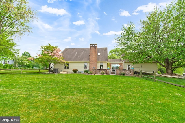 409 Hilltop Rd, Strasburg, PA 17579 - rear view of house featuring a yard