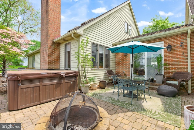 409 Hilltop Rd, Strasburg, PA 17579 - view of patio featuring a hot tub and an outdoor fire pit
