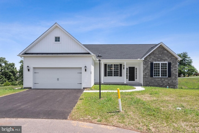 ranch-style home with a front lawn and a garage