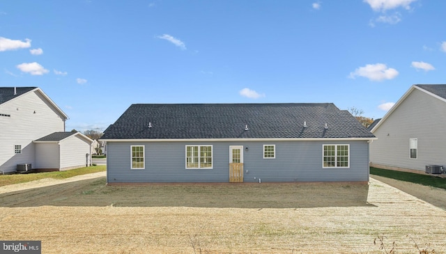 back of property featuring central AC