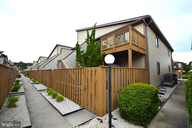 view of side of property featuring central AC unit