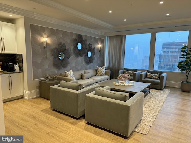 living room featuring crown molding and light wood-type flooring