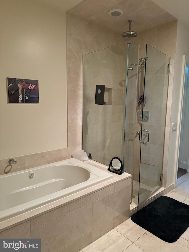 bathroom featuring tile floors and plus walk in shower