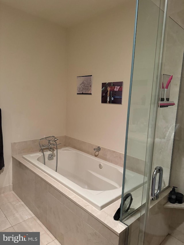 bathroom featuring tile floors and plus walk in shower