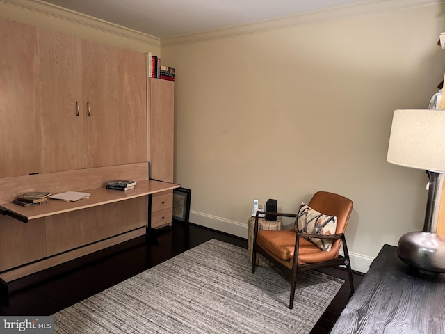 sitting room with crown molding and dark hardwood / wood-style floors