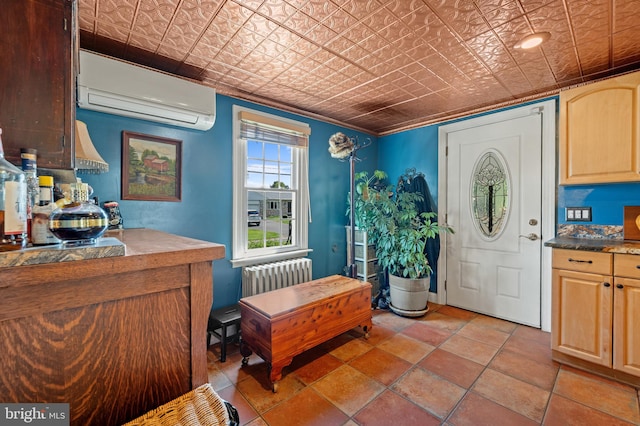 foyer featuring a wall mounted air conditioner and radiator