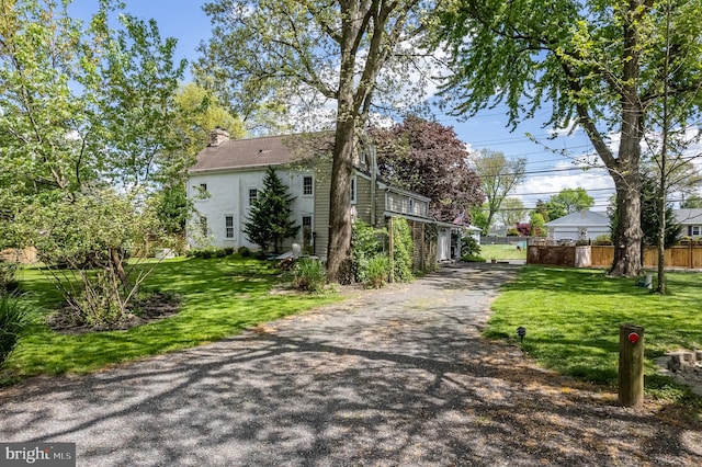 view of side of property featuring a yard