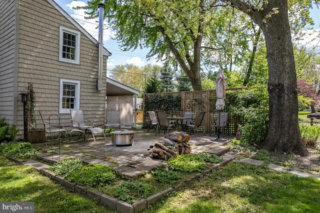 exterior space featuring an outdoor fire pit